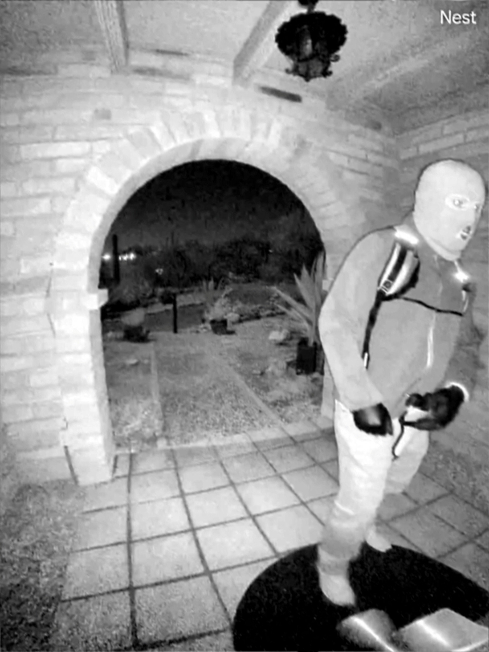 An image captured by a security camera shows what the Federal Bureau of Investigation (FBI) describes as an armed individual appearing to have tampered with the camera at Nancy Guthrie's front door the morning of her disappearance at her home in Tucson, Arizona February 1, 2026. — Pima County Sheriff's Department handout pic via Reuters