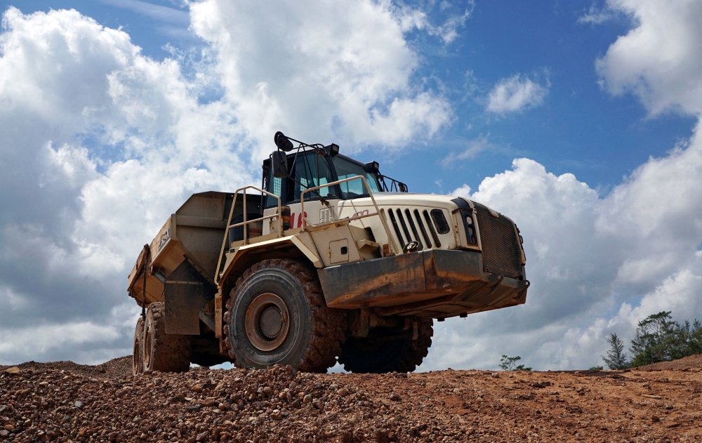 A truck passes through a tin mining area of Indonesia's PT Timah in Pemali, Bangka island, Indonesia, July 25, 2019. — Reuters pic