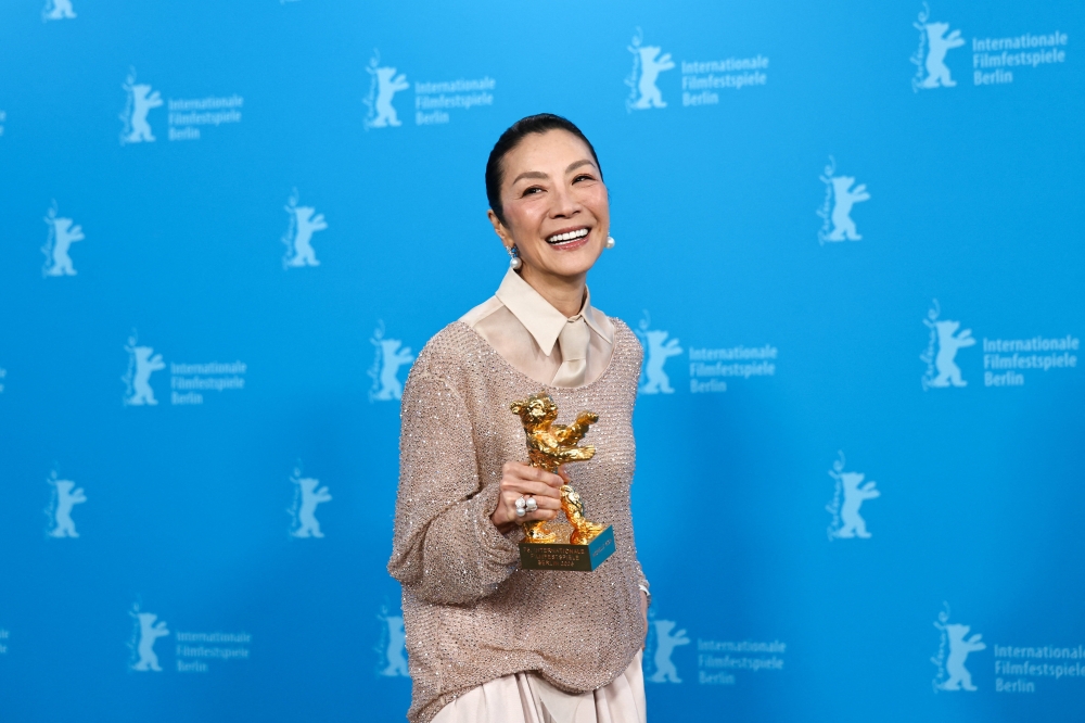 Tan Sri Michelle Yeoh, recipient of the 2026 Honorary Golden Bear, poses during a photocall at the 76th Berlinale International Film Festival in Berlin, Germany February 13, 2026. — Reuters pic