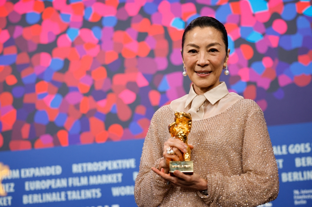 Tan Sri Michelle Yeoh, recipient of the 2026 Honorary Golden Bear, poses during a photocall at the 76th Berlinale International Film Festival in Berlin, Germany February 13, 2026. — Reuters pic