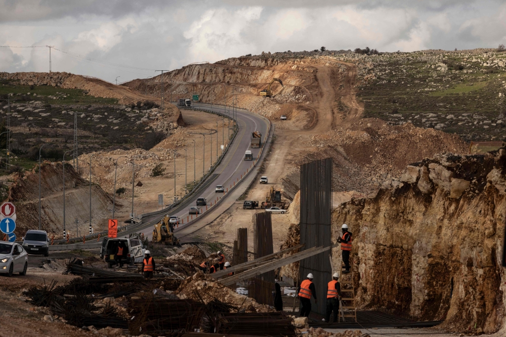 This photograph shows construction work to widen Route 60 outside Ramallah in the Israeli-occupied West Bank on February 11. — AFP pic