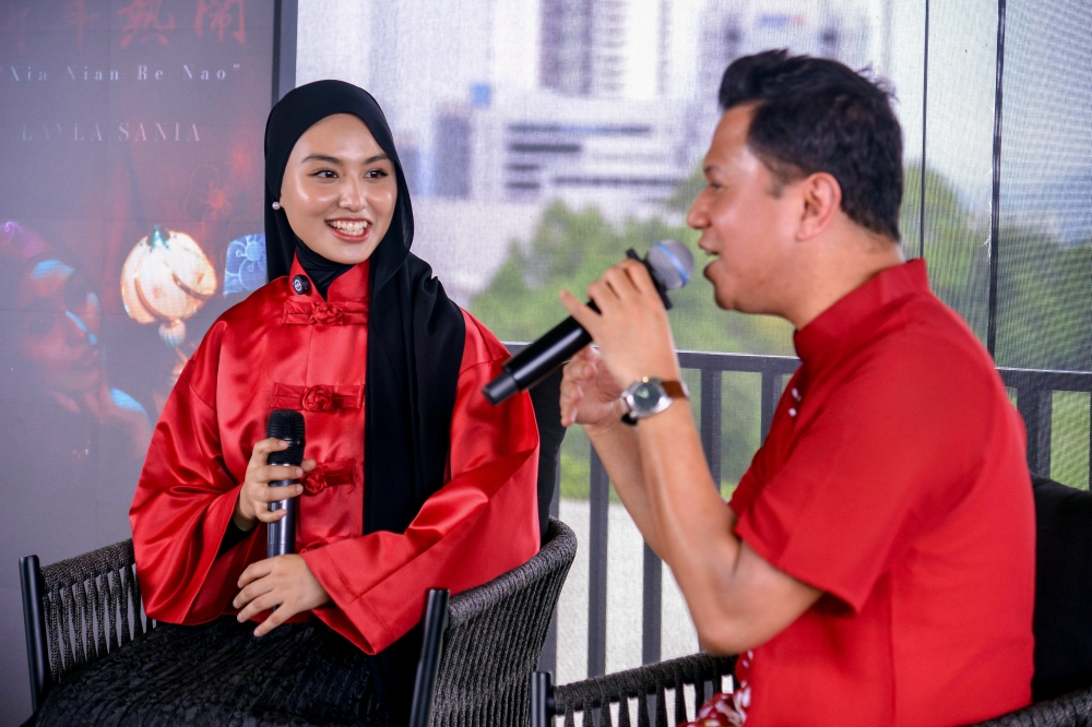 Singer Layla Sania Khairuzikri (left) during a press conference session at the launch of her first Chinese New Year song Xin Nian Re Nao at Santai House, Trec Kuala Lumpur. — Bernama pic