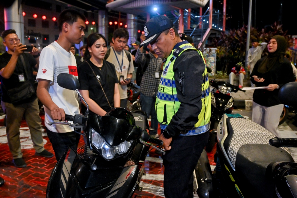 Kuala Lumpur Traffic Investigation and Enforcement Department (JSPT) chief Assistant Commissioner Mohd Zamzuri Mohd Isa conducts an inspection during Op Selamat 25 for Chinese New Year 2026 at Jalan Raja Laut in Kuala Lumpur on February 15, 2026. — Bernama pic