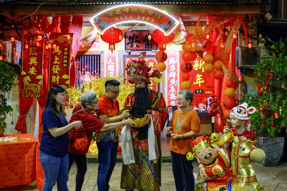 A performer wears the costume of the Chinese God of Wealth, Caishen, to enliven the Chinese New Year celebrations at Kampung Cina in Kuala Terengganu on February 15, 2026. — Bernama pic
