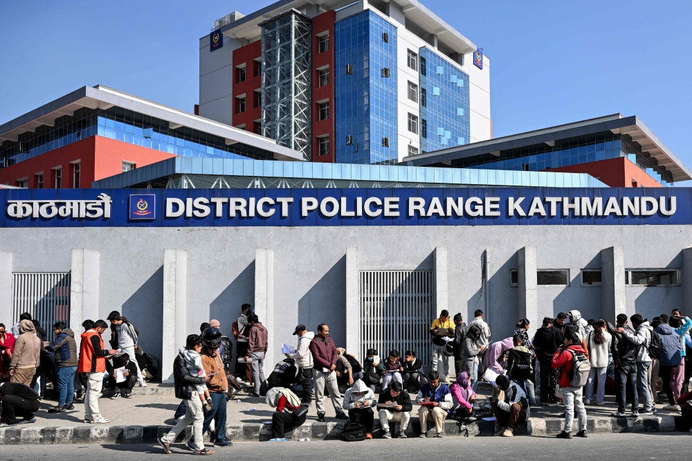 Nepali youth queue to submit applications for temporary police personnel for the upcoming general elections outside the District Police Range office in Kathmandu on January 11, 2026. — AFP pic