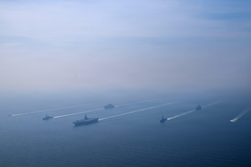 The US Navy’s Nimitz-class aircraft carrier USS Abraham Lincoln leads its strike group during a photo exercise in the Arabian Sea, February 6, 2026. Iran’s Islamic Revolutionary Guard Corps on Monday began a series of military exercises in the Strait of Hormuz, state media reported on the eve of talks with the United States. — US Navy/Mass Communication Specialist 1st Class Jesse Monford handout pic via Reuters