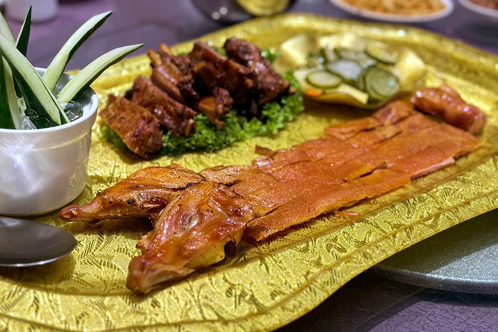 The ‘yin yang’ pork platter — half roast suckling pig, half grilled Iberico ribs. — Picture by CK Lim