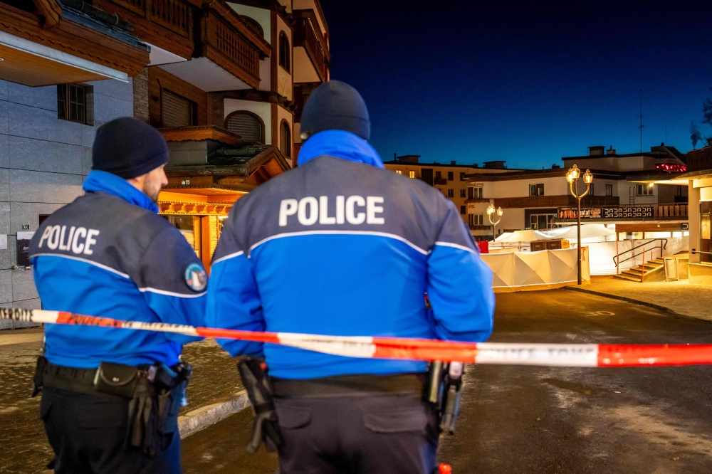 Police secure the street after a fire tore through a packed bar during New Year’s Eve celebrations in the Alpine ski resort of Crans-Montana on January 1, 2026. — AFP pic