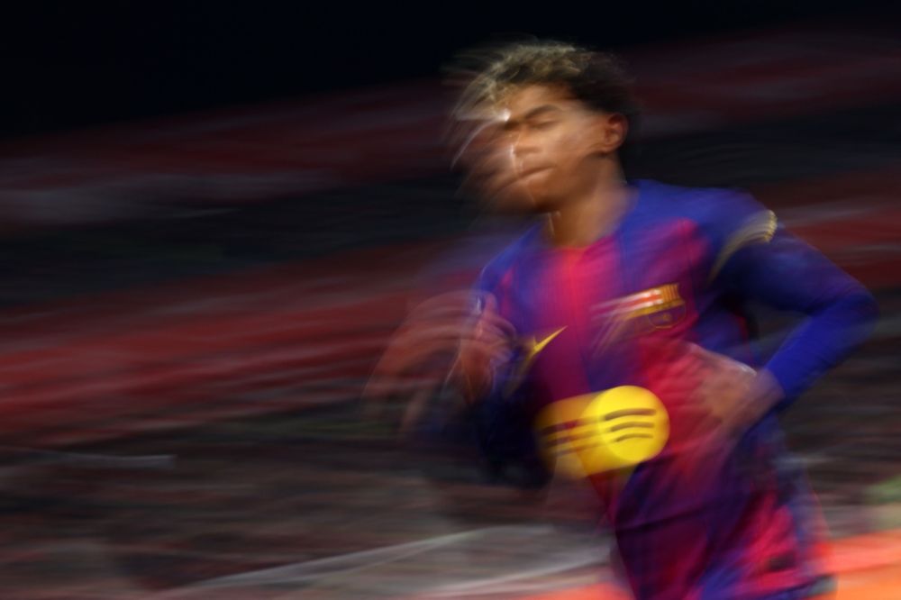Barcelona's Spanish forward Lamine Yamal runs during the Spanish league football match against Girona FC. — AFP pic