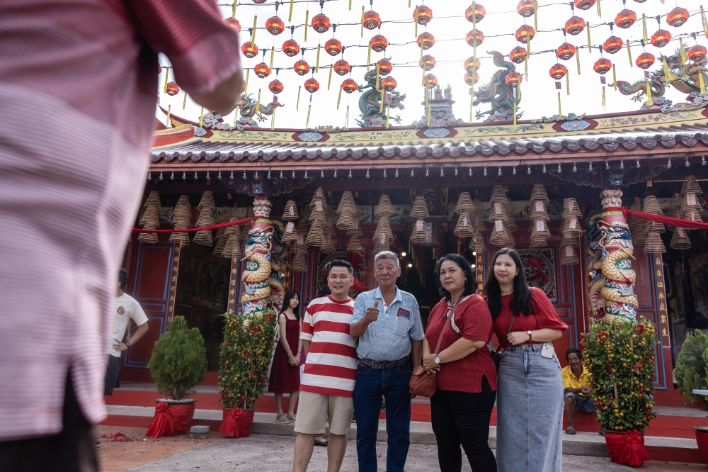 Members of the Chinese community take family photographs after performing religious prayers for Chinese New Year at Tokong Mek Tin Hin Kong, Kota Bharu, February 17, 2026. — Bernama pic