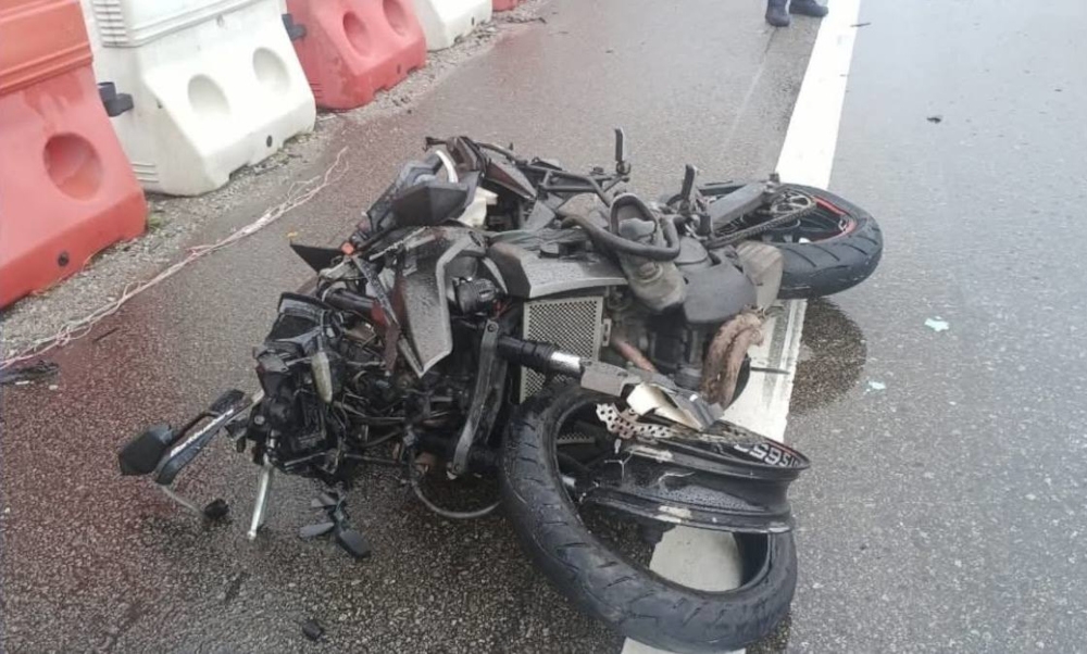Initial investigations found that the man lost control of the machine, which skidded and rammed the road divider. — Picture from Facebook/This is Johor