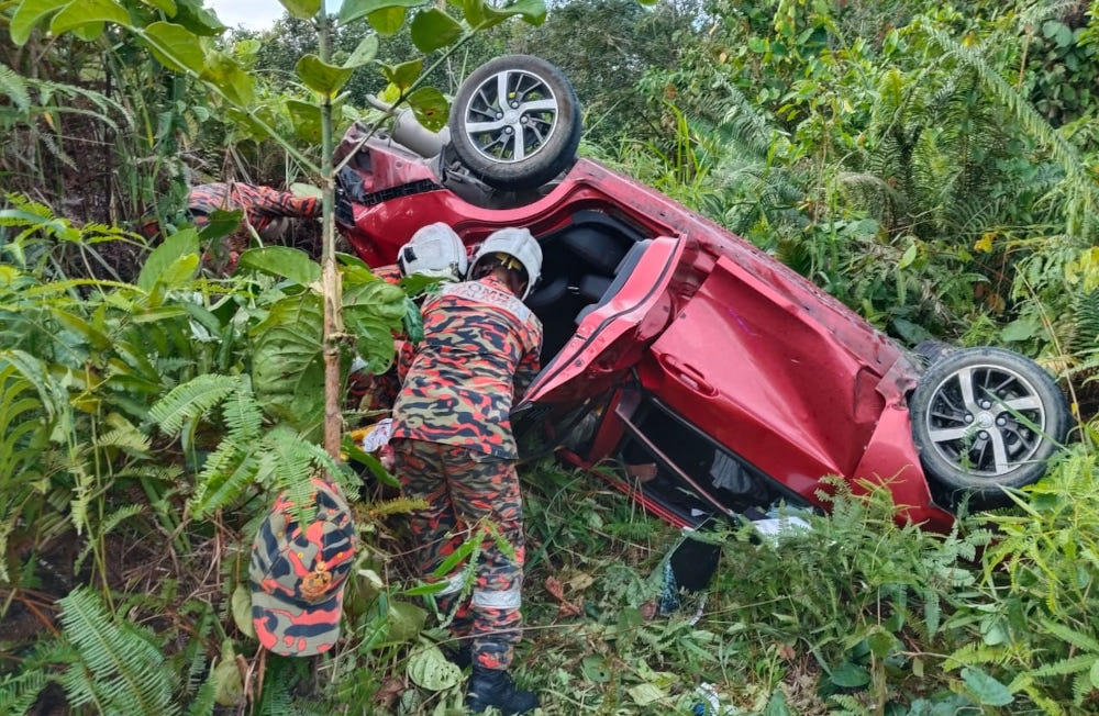 A Sarawak Fire and Rescue Department (JBPM) spokesperson said a team from Limbang Fire Station arrived at the scene about 16km from the station at 5.58pm, finding the car overturned with the driver trapped inside. — Picture from social media   