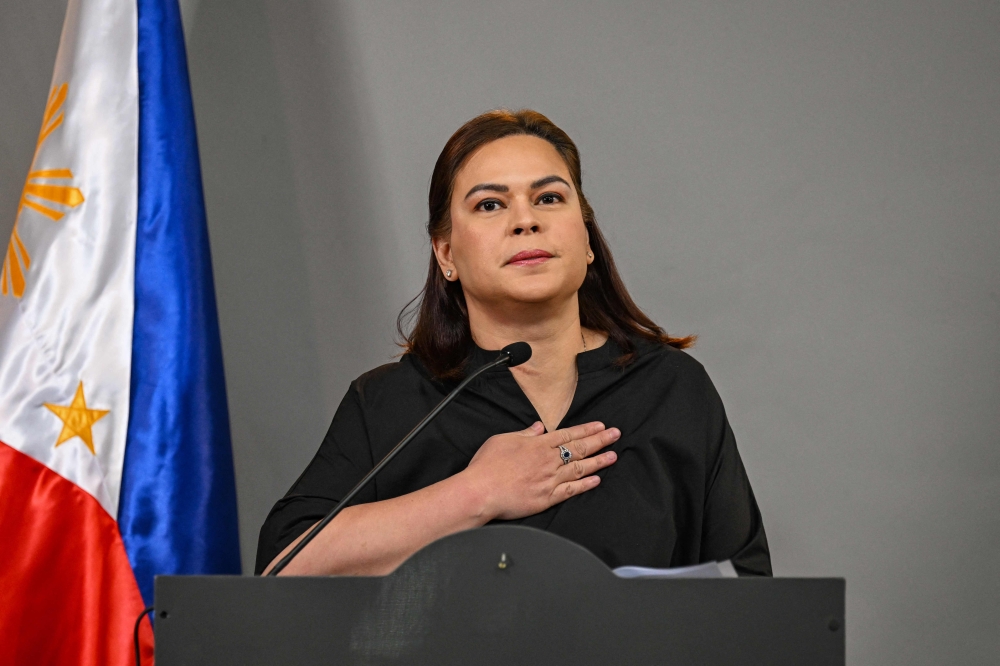 Philippine Vice President Sara Duterte announces her intention to run for the presidency in 2028 during a press conference in Mandaluyong, Metro Manila on February 18, 2026. — AFP pic