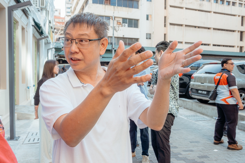Tim Loo is among a wave of owners who are opening businesses here. Tim said the area was very busy in the old days and now with the rejuvenation project, he expects the place to explode with tourists and locals. — Picture by Raymond Manuel.