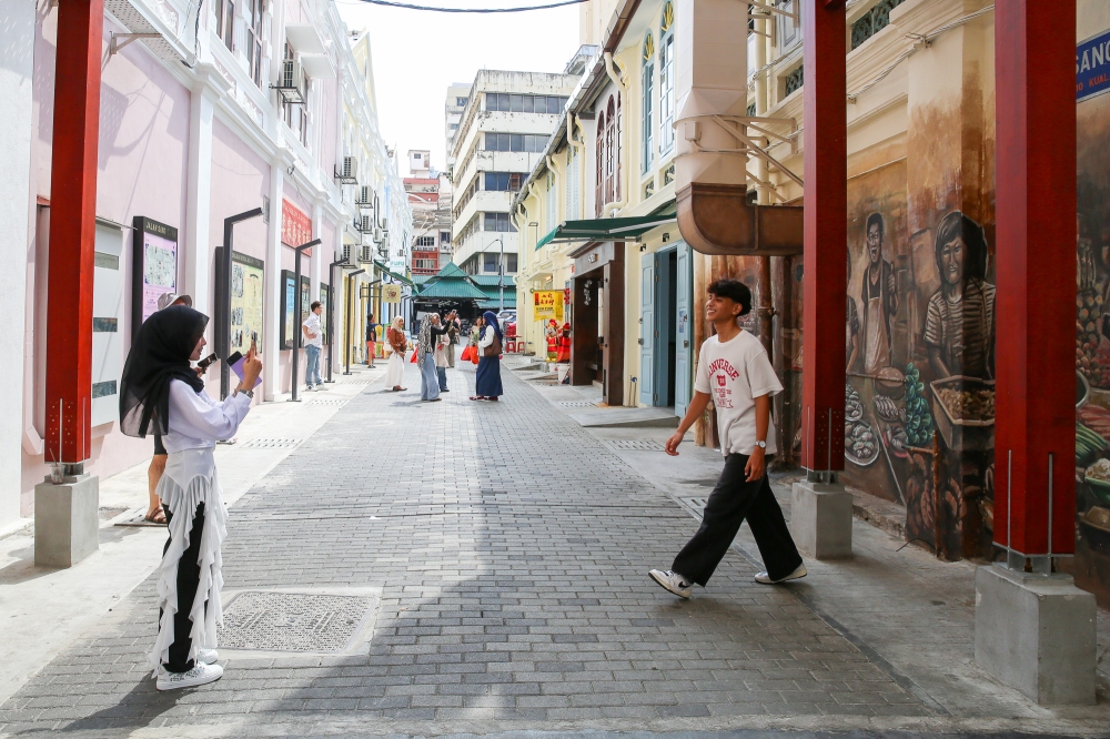 The cleaned up Jalan Sang Guna with its murals are perfect for picture-taking. — Picture by Choo Choy May