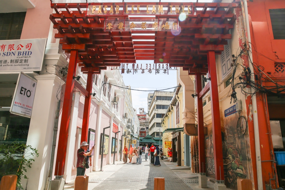 The vibrant new archway at one end of Jalan Sang Guna invites visitors to come in and explore the area.— Picture by Choo Choy May