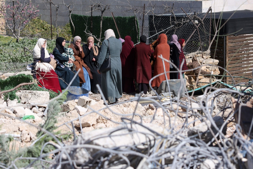 Members of the Salhab family react next to the rubble of their their apartment building after it was demolished by Israeli bulldozers near the Israeli settlement of Hagai, south of the occupied West Bank city of Hebron, on February 18, 2026. Israel’s far-right Finance Minister Bezalel Smotrich said he would pursue a policy of ‘encouraging the migration’ of Palestinians from the occupied West Bank and Gaza Strip, Israeli media reported on February 18. — AFP pic 