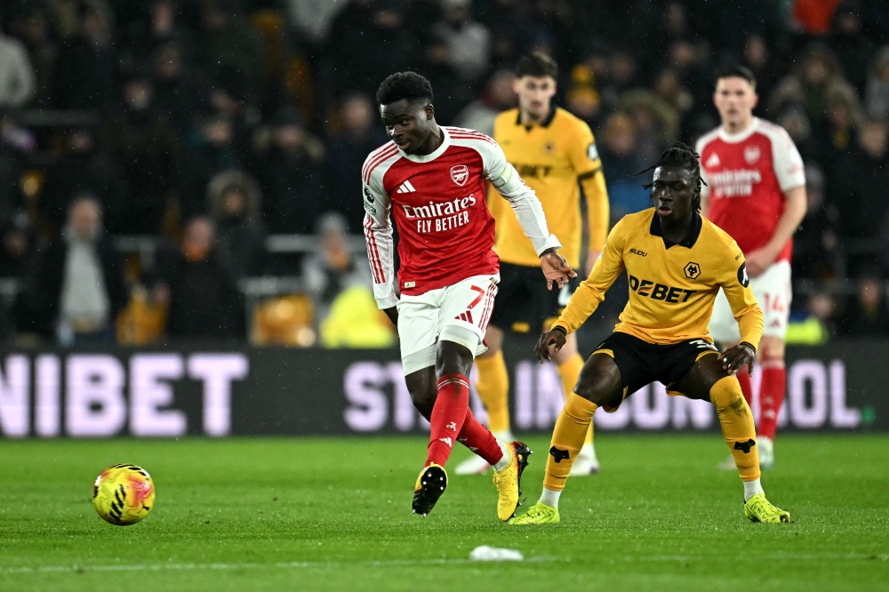 Arsenal’s English midfielder #07 Bukayo Saka passes the ball during the English Premier League football match between Wolverhampton Wanderers and Arsenal at the Molineux stadium in Wolverhampton, central England on February 18, 2026. — AFP pic 