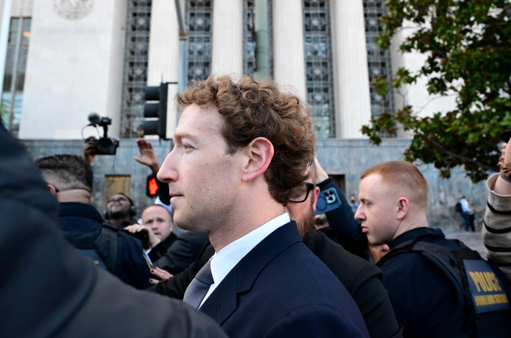 Meta CEO Mark Zuckerberg leaves the Los Angeles Superior Court after testifying on February 18, 2026 in Los Angeles, California. A 20-year-old California woman sued Meta and YouTube, accusing them of building addictive platforms that cause harm to children. — Wally Skalij/Getty Images pic via AFP 