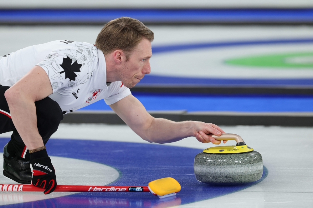 Canada's Marc Kennedy delivers the stone during the curling men's round robin between Czech Republic and Canada during the Milano Cortina 2026 Winter Olympic Games at the Cortina Curling Olympic Stadium in Cortina d’Ampezzo on February 16, 2026. — AFP pic 