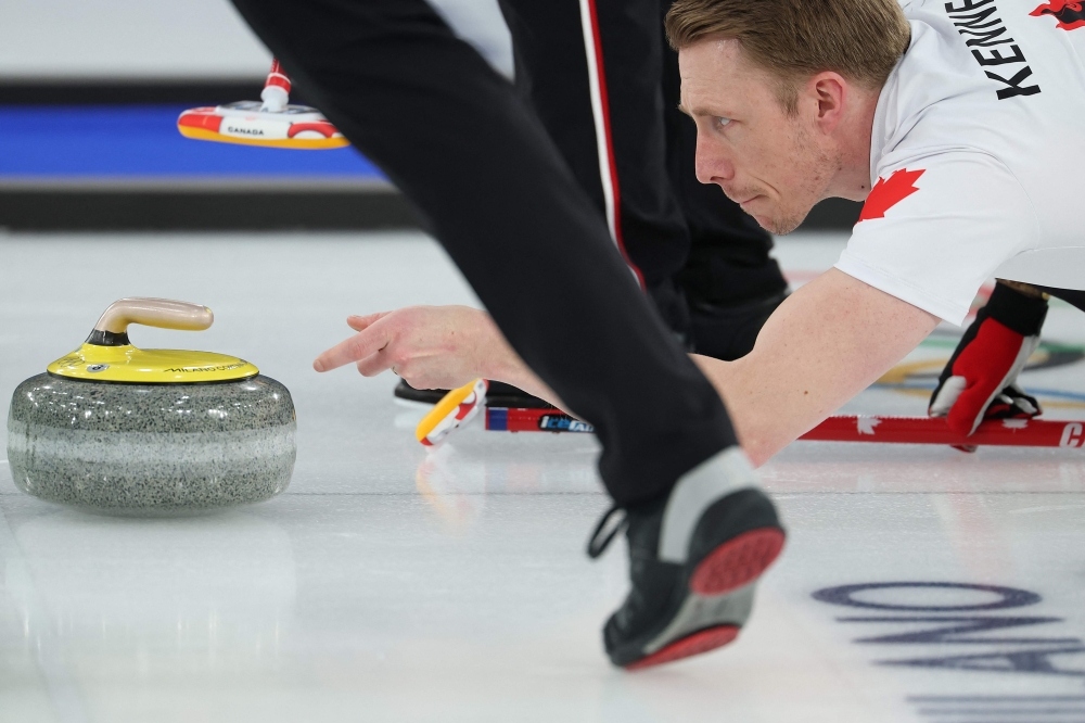 Canada's Marc Kennedy delivers the stone during the curling men's round robin between Czech Republic and Canada during the Milano Cortina 2026 Winter Olympic Games at the Cortina Curling Olympic Stadium in Cortina d’Ampezzo on February 16, 2026. — AFP pic 