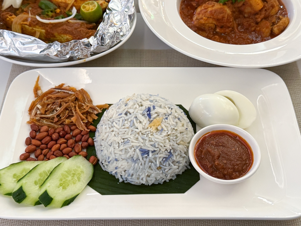 Order the Basmati Blue Pea Rice served 'nasi lemak' style with a side dish from their weekday Brunch Menu. 