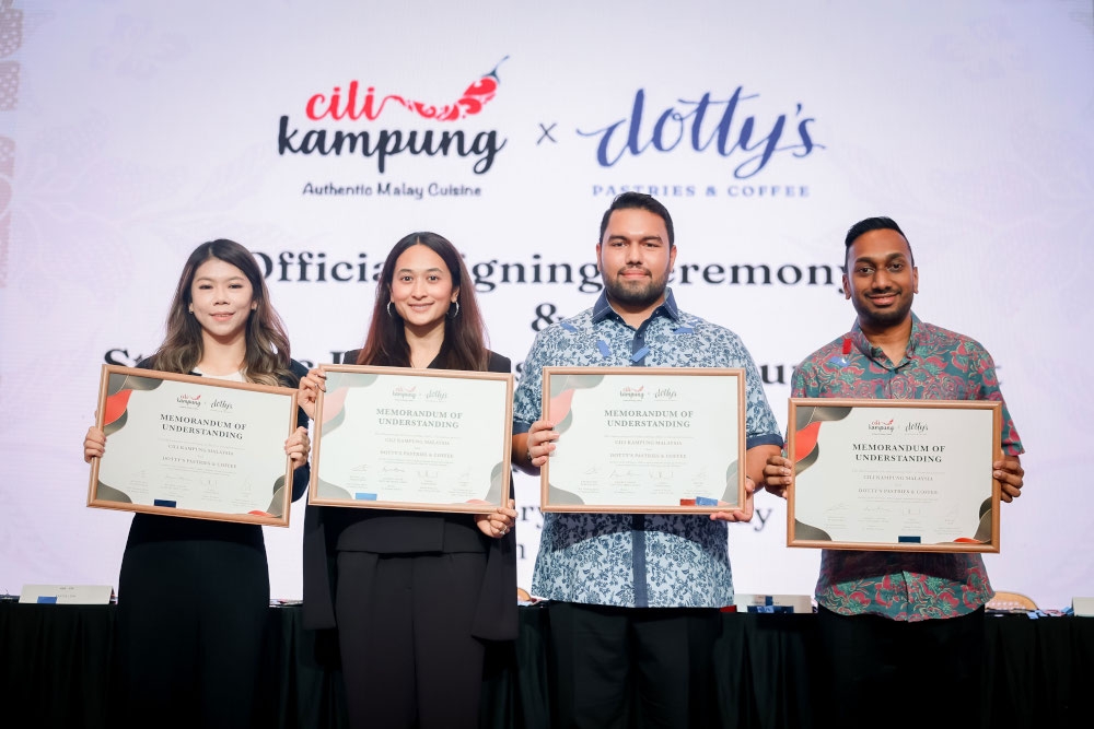 (From left) Kaylee Low, senior commercial and business development manager, Dotty’s Pastries and Coffee, Nadia Nasimuddin, founder and director of Dotty’s Pastries and Coffee, Anwar Azeez, director of Cili Kampung Malaysia, Kesavan (KC) Purusotman, chief marketing officer of Cili Kampung Malaysia at the MOU signing ceremony marking Cili Kampung Malaysia’s strategic acquisition of a 50 per cent stake in Dotty’s Pastries and Coffee. — Picture courtesy of Cili Kampung Malaysia/Dotty's Pastries and Coffee