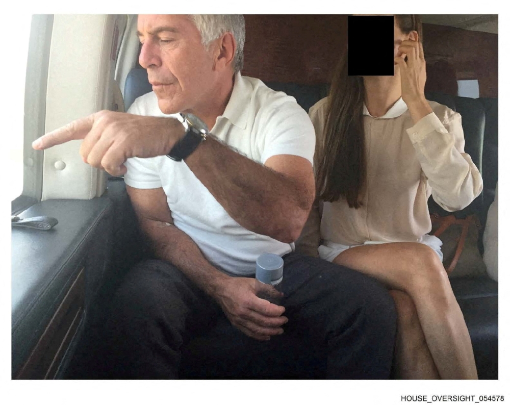 Late financier and convicted sex offender Jeffrey Epstein appears with a woman, whose identity has been obscured, in this image from the Epstein estate released by House Oversight Committee Democrats in Washington, DC, on December 18, 2025. — House Oversight Committee Democrats handout pic via Reuters 