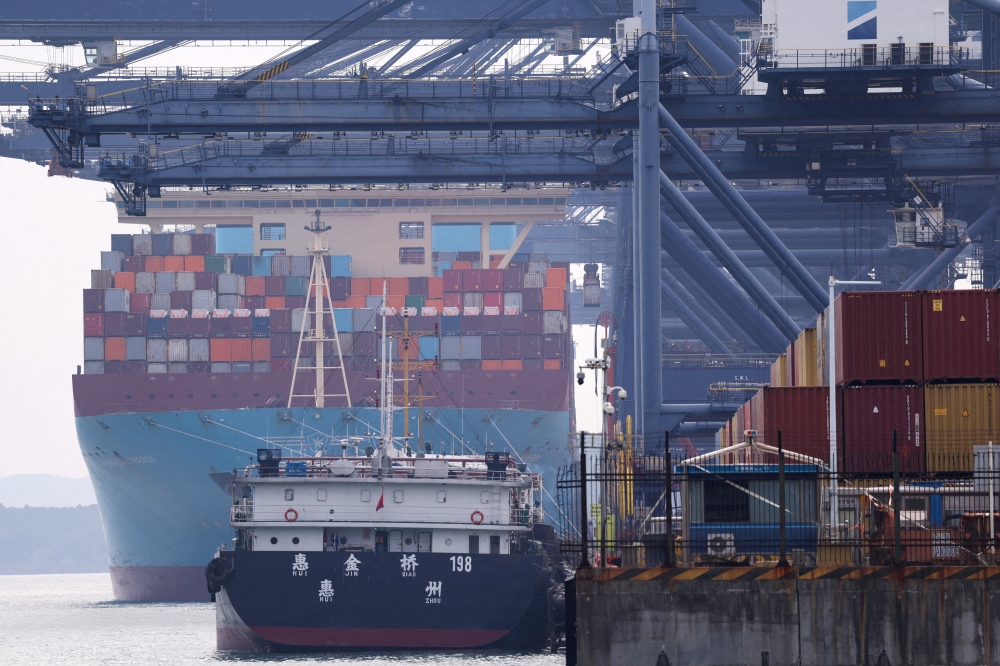 A cargo ship with containers docks at a terminal of the Yantian port in Shenzhen, Guangdong province, China October 30, 2025.
