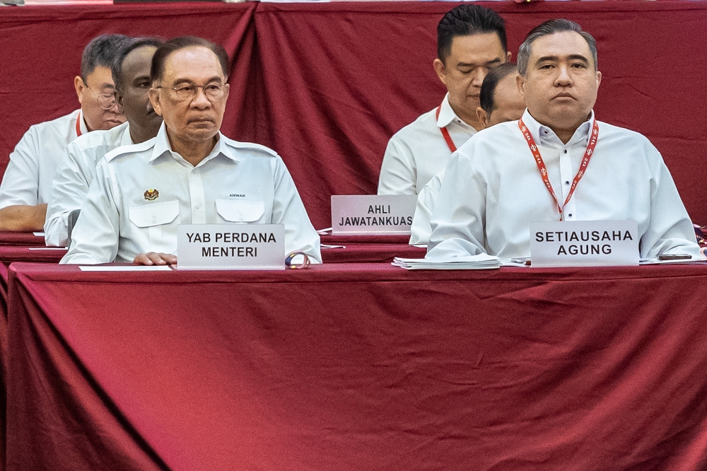 Prime Minister Datuk Seri Anwar Ibrahim with DAP secretary-general Anthony Loke Siew Fook during the 18th DAP National Congress at Ideal Convention Centre (IDCC), in Shah Alam, last year. — Picture by Firdaus Latif