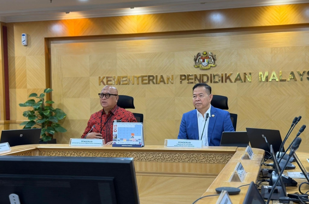 Deputy State Secretary (Economic Planning and Development) Datuk Seri Muhammad Abdullah Zaidel and the Ministry of Education (MOE) secretary-general Datuk Aminuddin Hassim co-chair the meeting. — Picture courtesy of Ukas  	