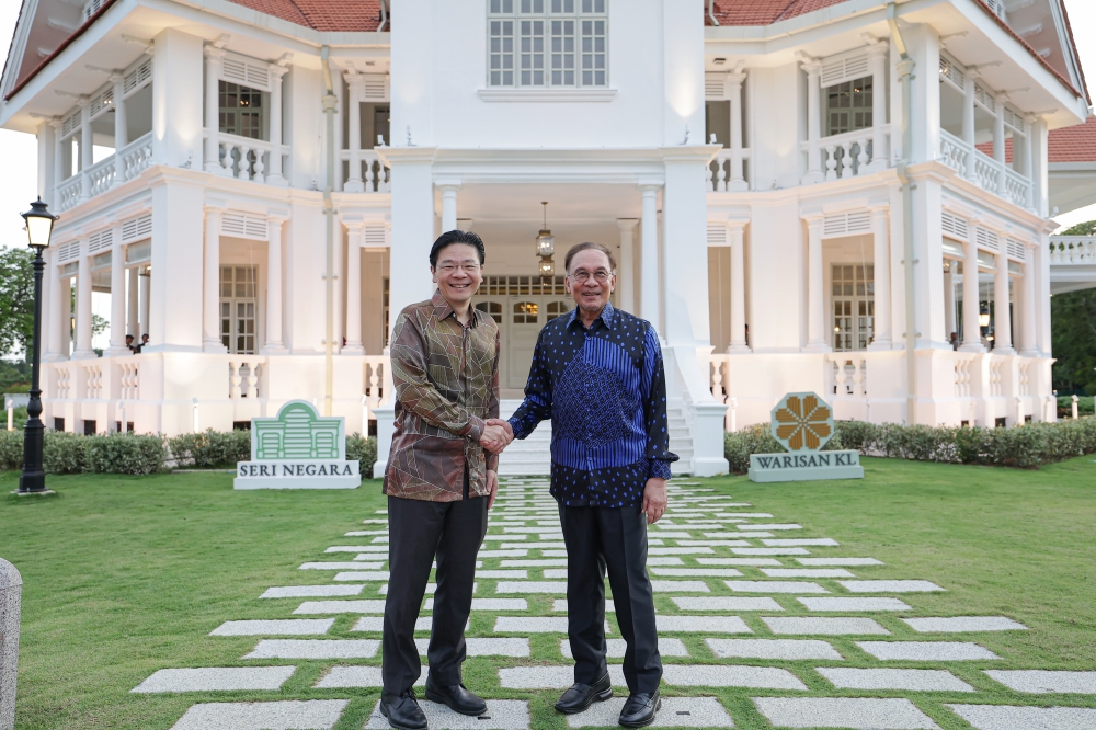 Prime Minister Datuk Seri Anwar Ibrahim shakes hands with Singapore Prime Minister Lawrence Wong in front of the historic landmark, Seri Negara in conjunction with Wong’s special visit to Malaysia February 20, 2026. — Bernama pic