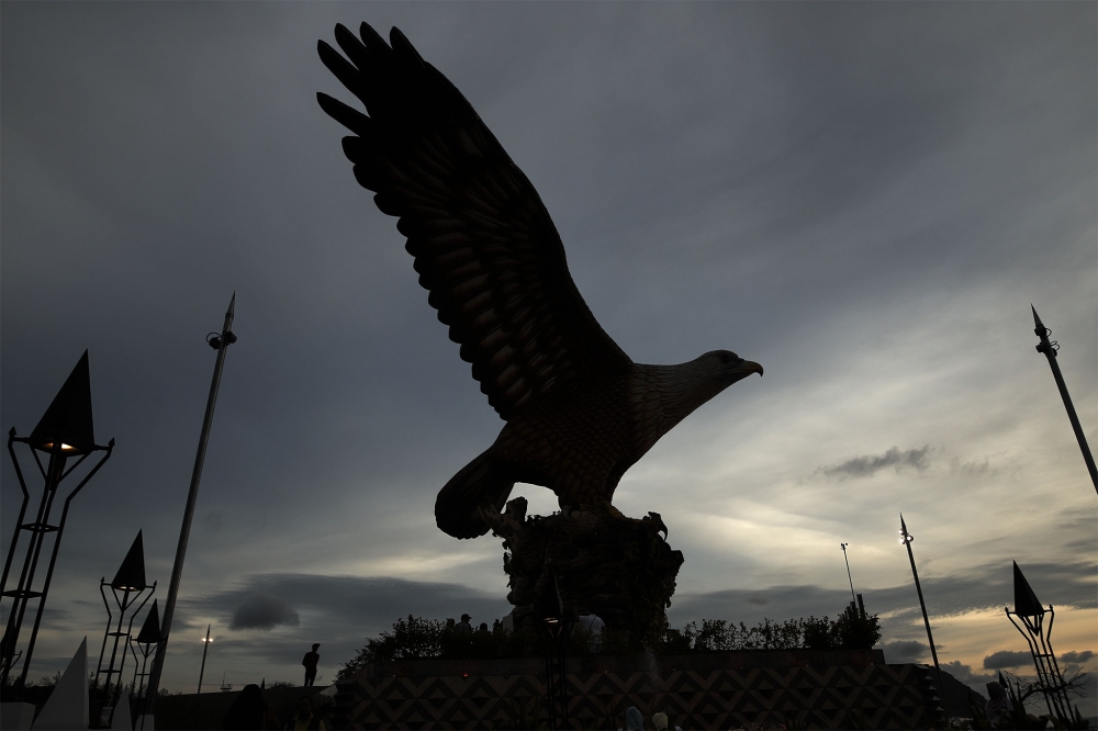 Rescue teams are searching the waters off Pantai Tanjung Rhu in Langkawi after a 49-year-old Chinese tourist went missing while swimming with his son. — Picture by Azneal Ishak