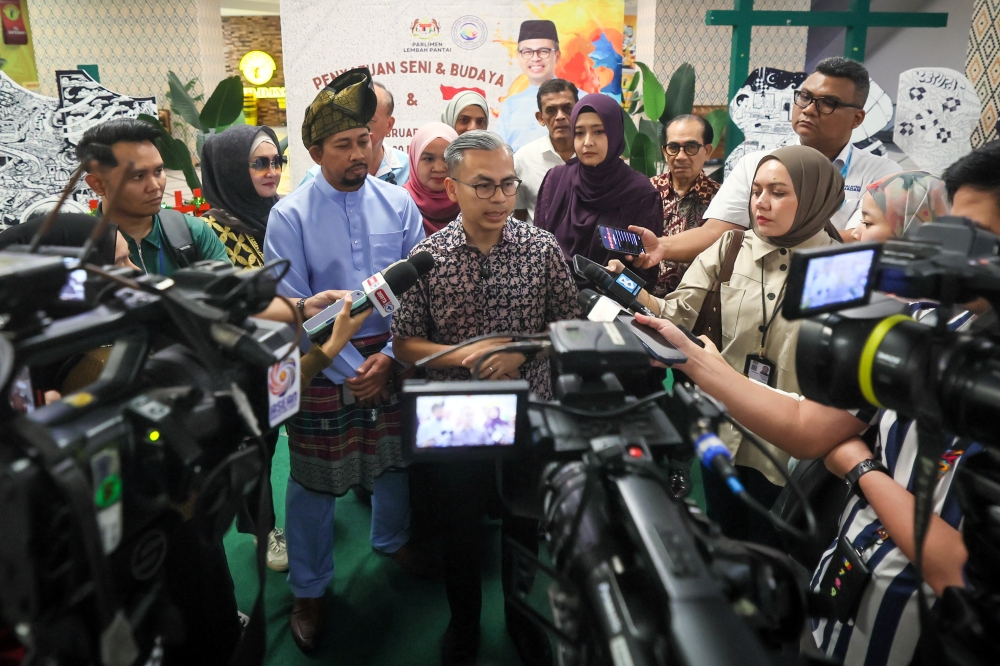 Datuk Fahmi Fadzil speaks to reporters after officiating the Arts and Cultural Unity Programme at KL Gateway Mall in Kuala Lumpur February 21, 2026. — Bernama pic