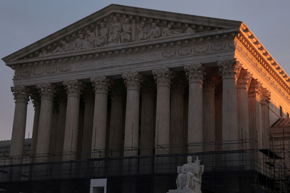 Light from the rising sun hits the U.S. Supreme Court building at the start of the day in Washington, D.C. US, January 12, 2026. — Reuters pic