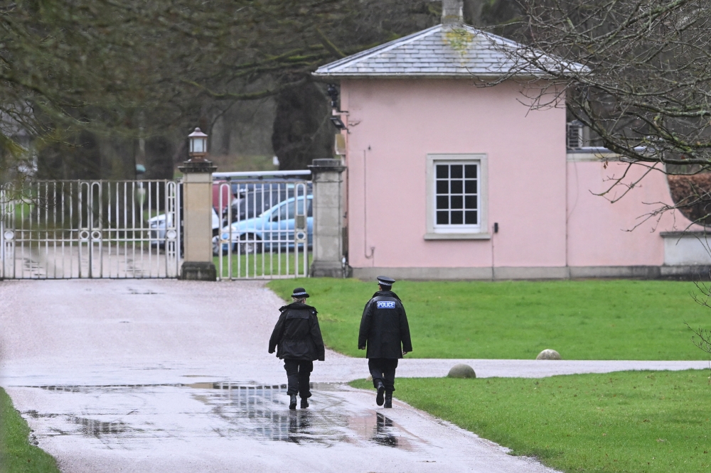 Police officers walk near an entrance of the Royal Lodge, a property on the estate surrounding Windsor Castle and a former residence of Andrew Mountbatten-Windsor, younger brother of Britain's King Charles, formerly known as Prince Andrew, a day after Andrew Mountbatten-Windsor was released following arrest on suspicion of misconduct in public office, after the US Justice Department released more records tied to the late financier and convicted sex offender Jeffrey Epstein, in Windsor February 20, 2026. — Reuters pic 