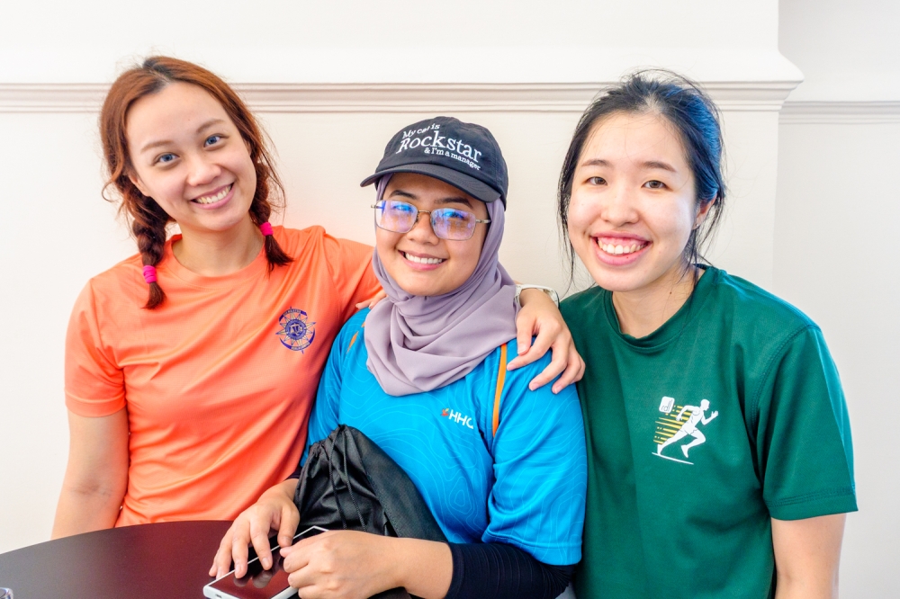 Lawyers Ong Shu Cing (left), Aida Suhailah (centre) and Jessy Lai stop by the Sultan Abdul Samad Building for a coffee break. — Picture by Raymond Manuel