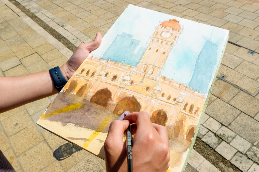 Lim Shi Rong’s painting of the Sultan Abdul Samad Building during its reopening. — Picture by Raymond Manuel