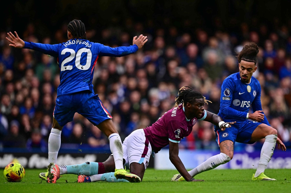 Burnley’s French midfielder #08 Lesley Ugochukwu (C) hits the deck during the English Premier League football match between Chelsea and Burnley at Stamford Bridge in London on February 22, 2026. — AFP pic
