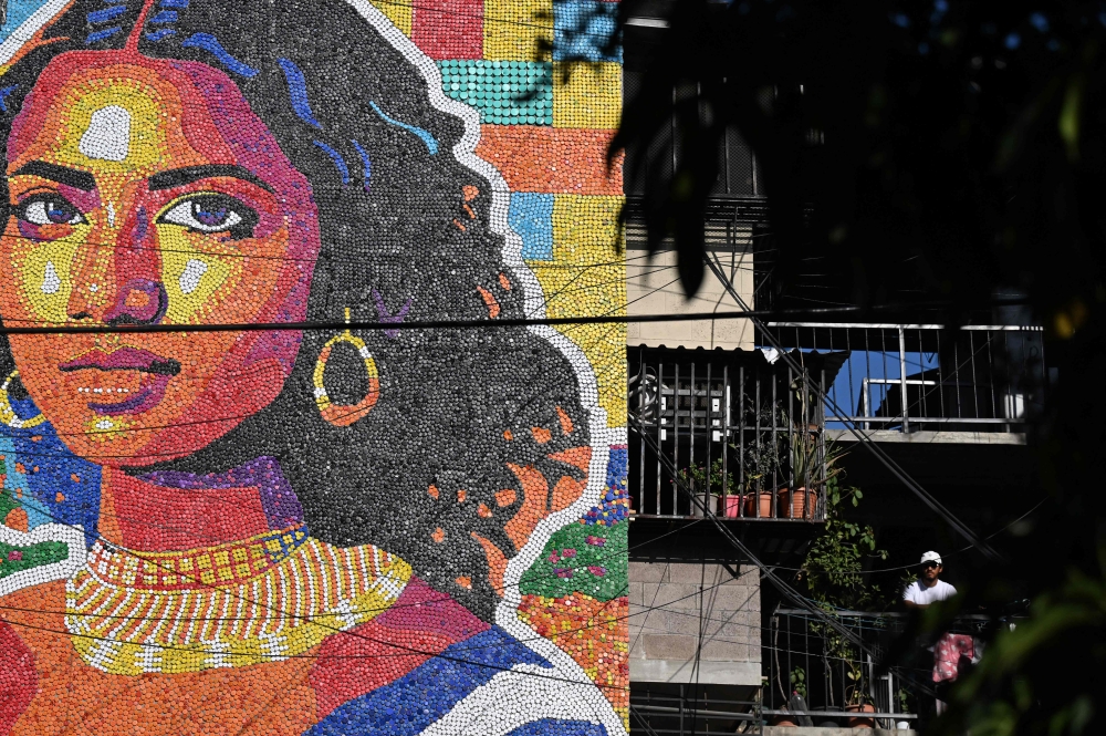 A massive mural made of plastic bottle caps depicts Latin America’s version of the famed Mona Lisa. — AFP pic