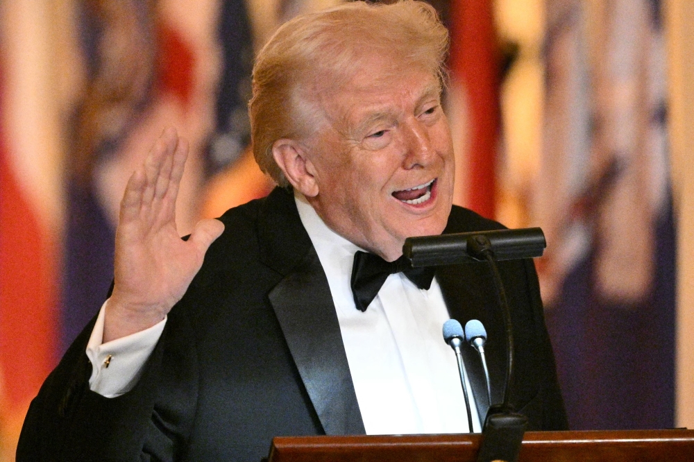 US President Donald Trump speaks during a dinner with state governors in the East Room of the White House in Washington, DC, on February 21, 2026. — AFP pic