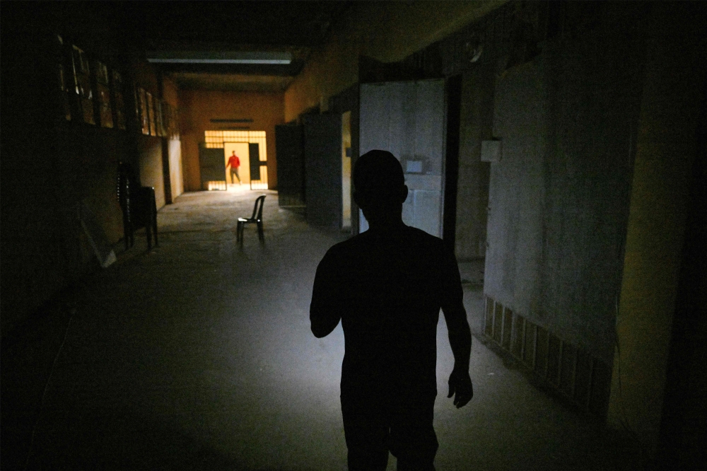 A person walks on a set depicting a recreation of the infamous Syrian Assad-regime prison of Saydnaya, during the filming of the Arabic TV Series ‘Al-Khuruj min al-Beir’ (Exiting the Well) in Zouk Mikhael, north of Beirut, on February 17, 2026. — AFP pic