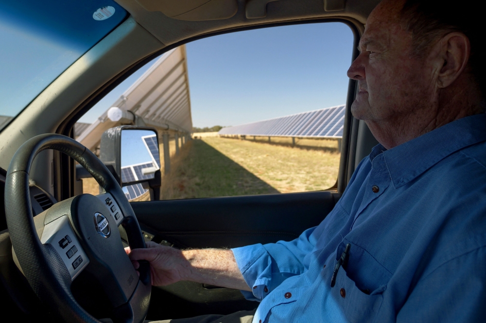 Australian farmer Tom Warren’s solar panels look like any other – until you spot the dozens of sheep grazing and napping, helping the country transition to green energy and earning him a decent income while doing it. — AFP pic