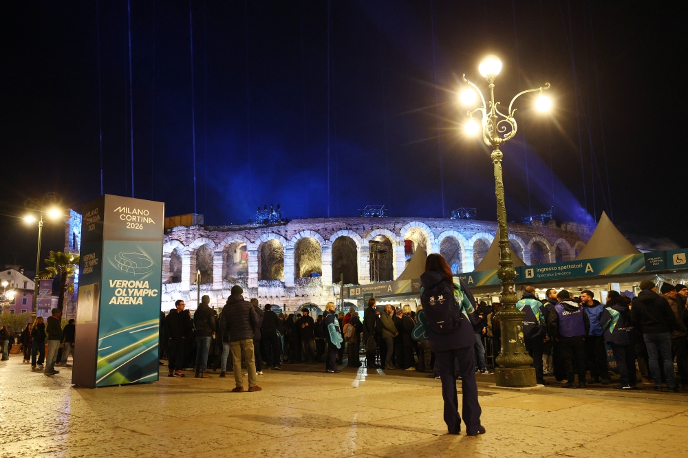 People wait for the grand finale to the 2026 Winter Olympics at the Arena di Verona in Verona as host Italy promises to end the sporting competition with a bang. — Reuters pic