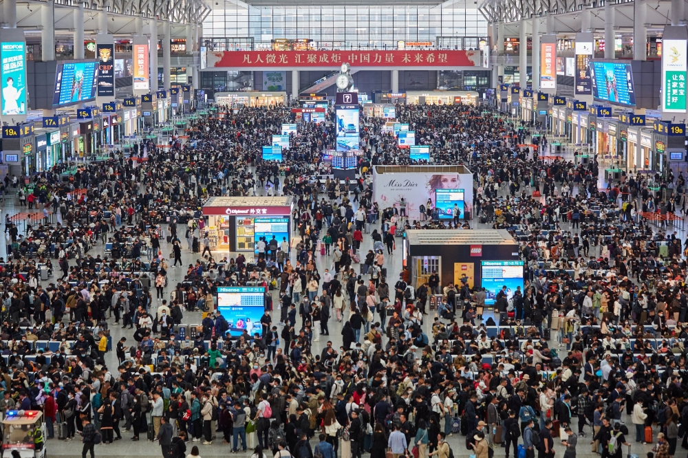 Travellers wait for their trains at the Shanghai Hongqiao railway station as China logs over 250 million passengers in the 2026 Spring Festival, and it’s only halfway through the travel season. — China Daily via Reuters pic