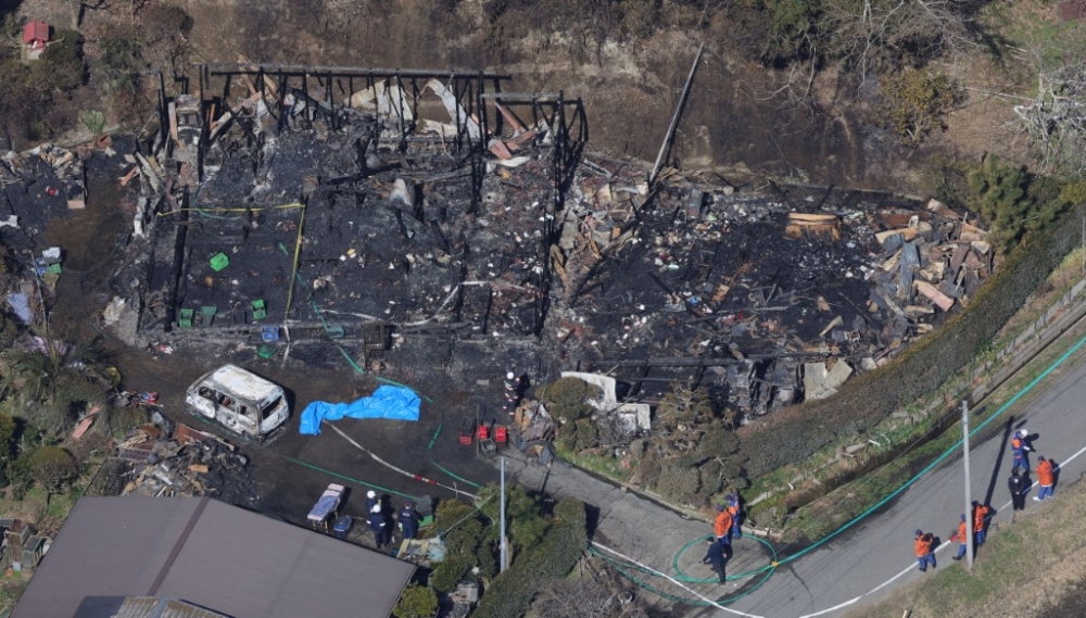 Three bodies of unknown gender were found at this wooden house that was completely destroyed by fire in Mutsuzawa Town, Chiba Prefecture on February 22, 2026. Six people had lived at the house, and two elementary school girls and a woman in her 60s who is believed to be the grandmother have not been contacted. — Picture by The Yomiuri Shimbun via AFP