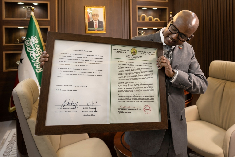 Minister of the Presidency of the Republic of Somaliland, Khadar Hussein Abdi poses with a framed certificate containing a signed declaration of recognition as a state by Israel during an interview in Hargeisa on February 21, 2026. — AFP pic