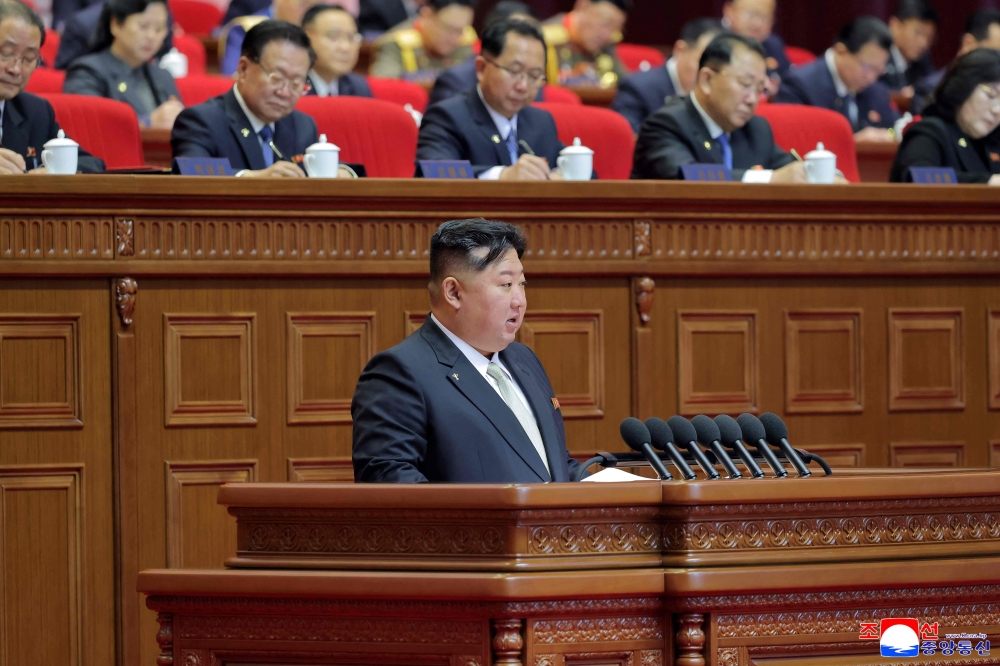 This picture released by KCNA shows North Korean leader Kim Jong Un reporting on the review of the work of the eighth-term Party Central Committee during the Ninth Congress of the Workers' Party of Korea in Pyongyang. — AFP pic