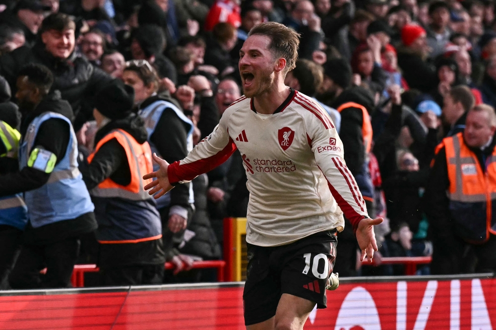 Liverpool's Argentinian midfielder Alexis Mac Allister celebrates after scoring the team's first goal. — AFP pic