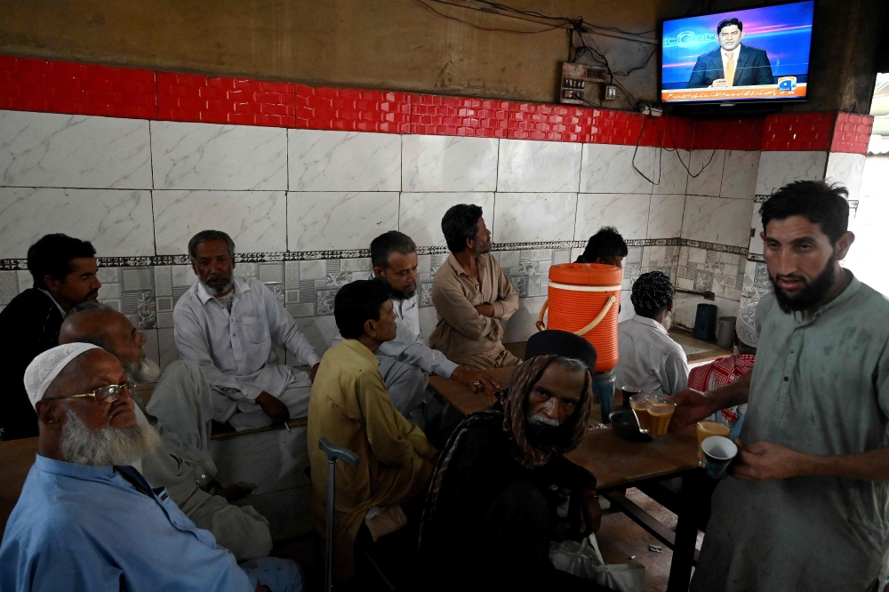 Pakistani-Bengalis sitting at a tea-stall in Karachi. There are estimated to be over a million ethnic Bengalis now living in Pakistan, many of whom arrived during the war, after which East Pakistan declared independence and became Bangladesh. — AFP pic